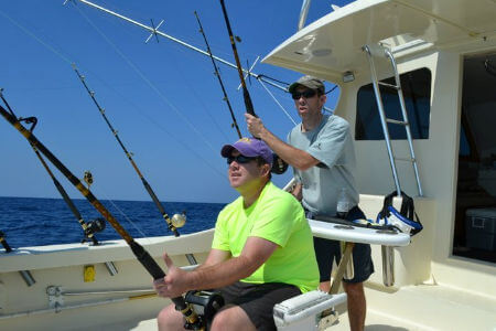 Man fighting fish from fighting chair on Sea Dream Charters.